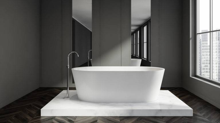 large white bathtub in luxurious bathroom